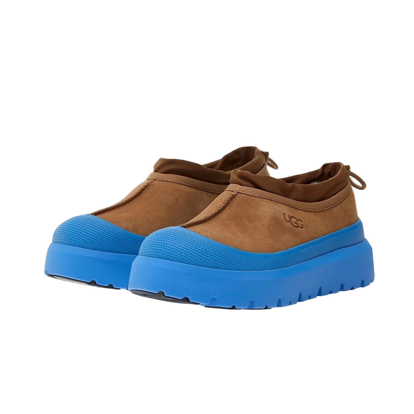Brown shoes with blue soles on a white background