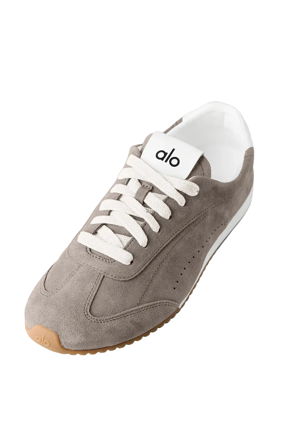 Gray sneaker with white laces and sole on a light gray background