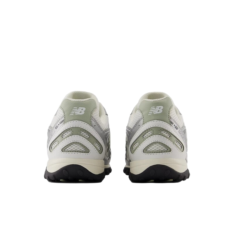 Pair of green and white sneakers on a white background