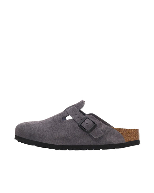 Gray suede clog shoe with a brown insole on a white background