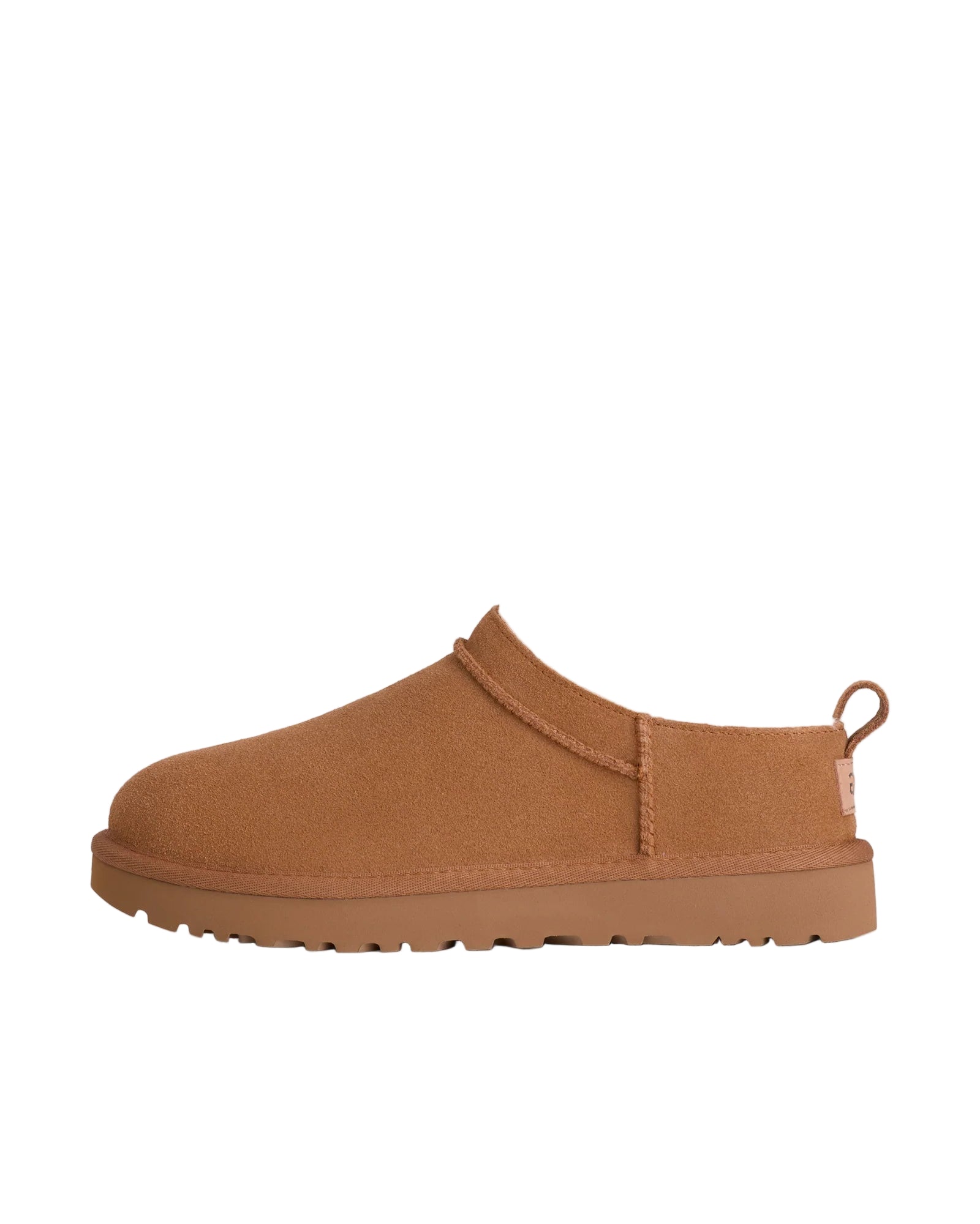 Brown slip-on shoe on a white background