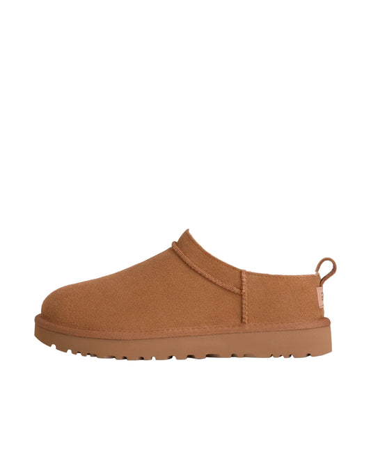 Brown slip-on shoe on a white background