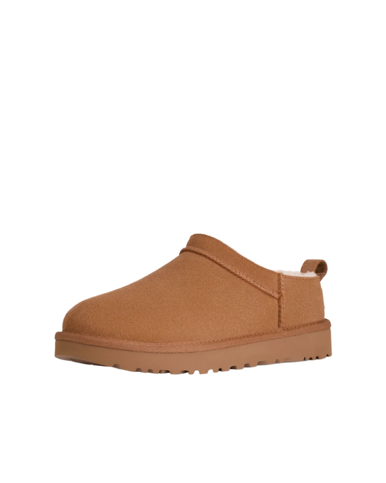 Brown slip-on shoe with a platform sole on a white background