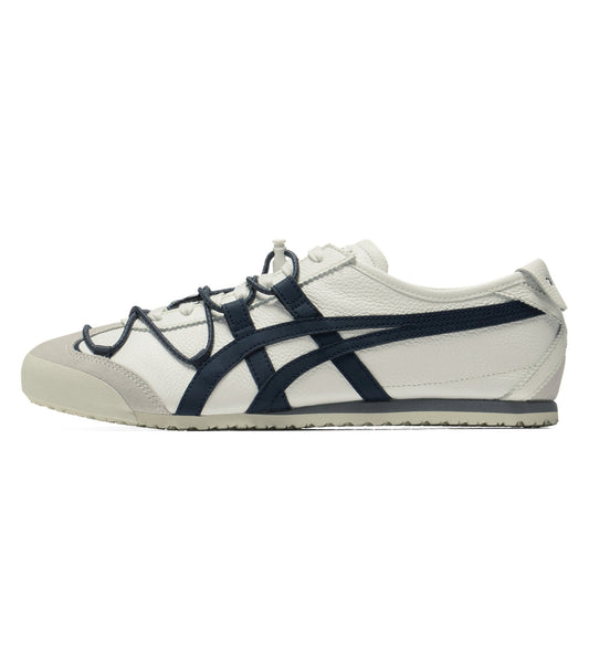 A classic low-top sneaker in off-white leather with navy blue stripes and laces, shown in a side profile on a white background.