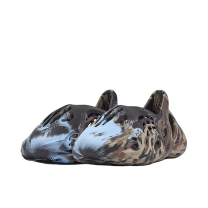 Pair of camouflage-patterned shoes on a white background