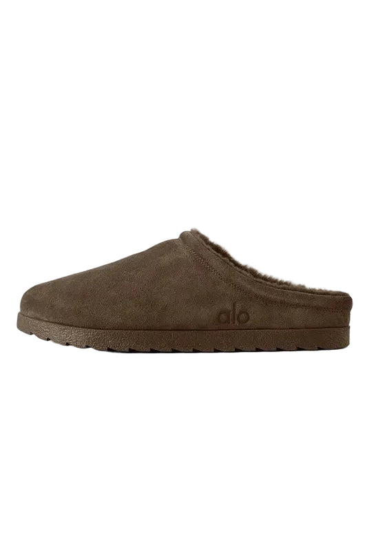 Brown slipper with brand logo on a light gray background