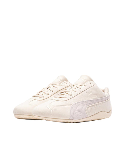 Pair of light-colored sneakers on a white background
