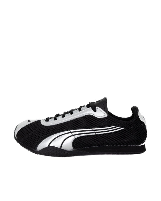 Black and white sneaker on a light gray background