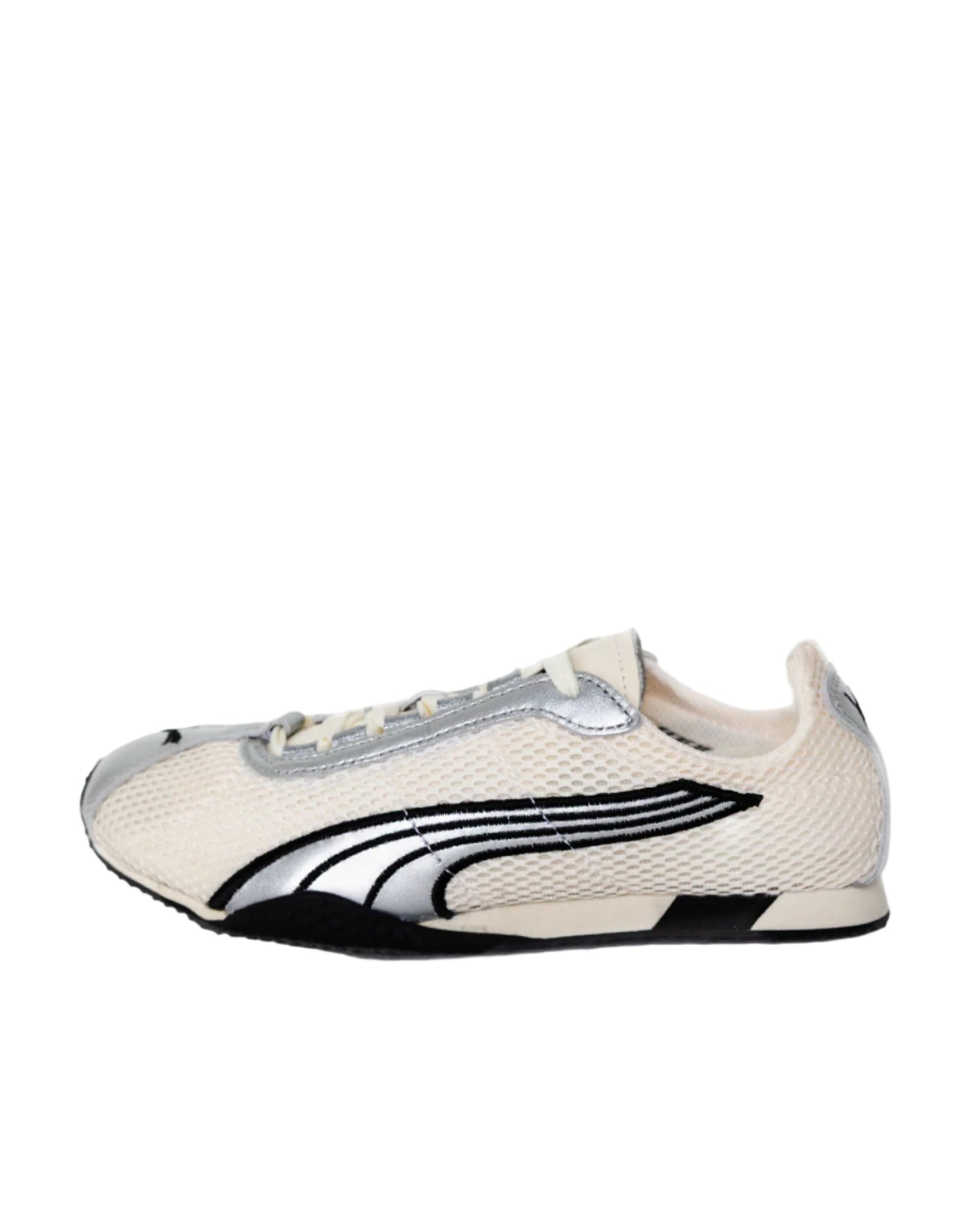 White sneaker with black and gray accents on a white background