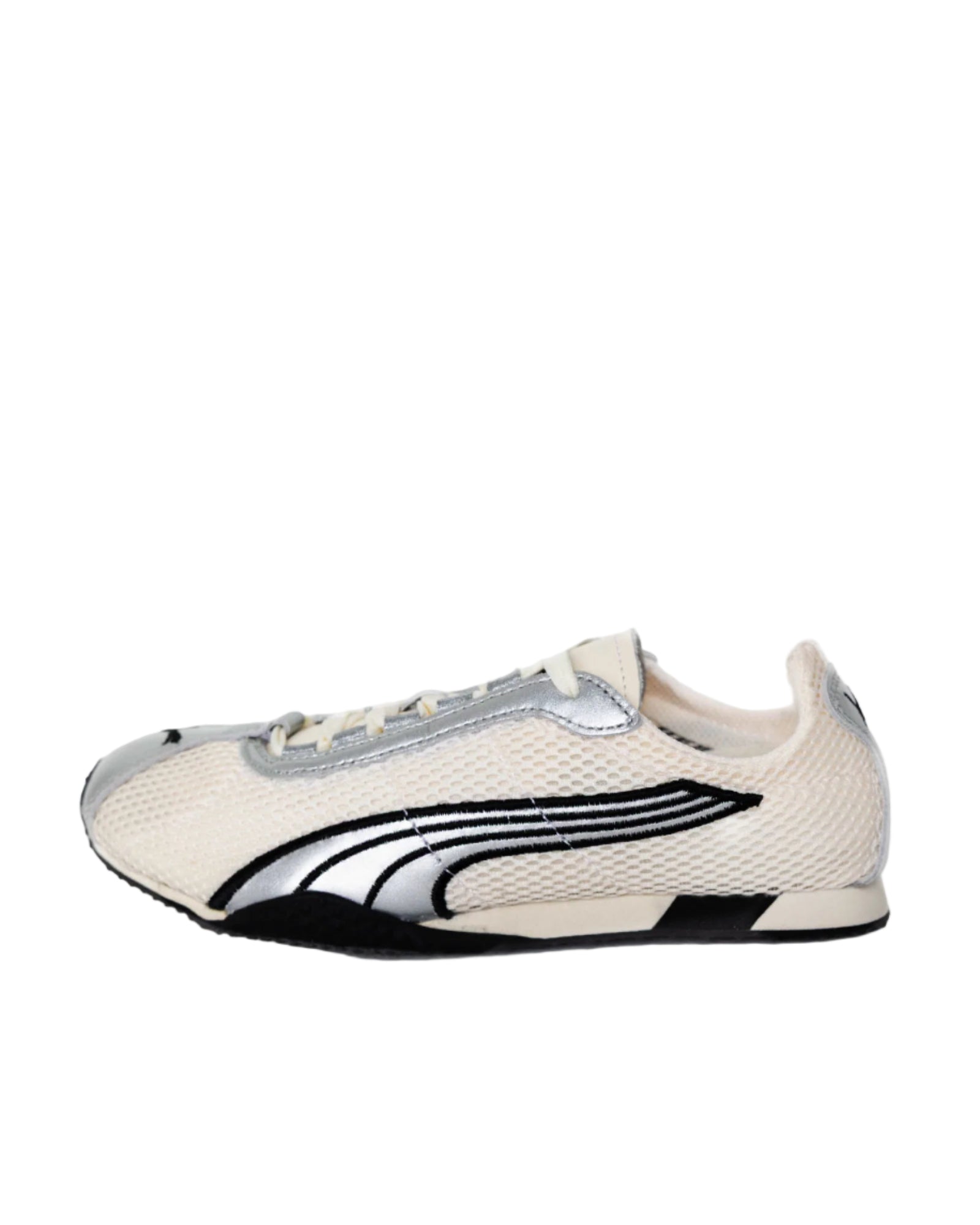 White sneaker with black and gray accents on a white background