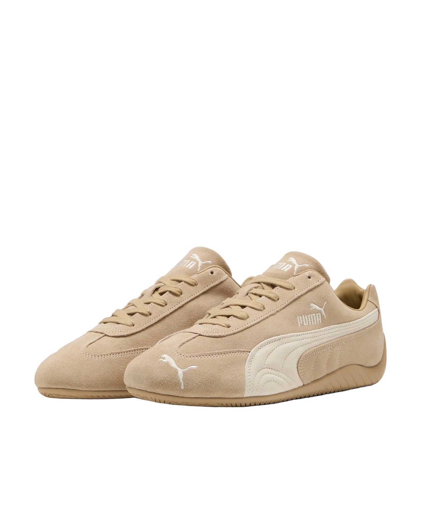 Beige sneakers with a white logo on a light gray background