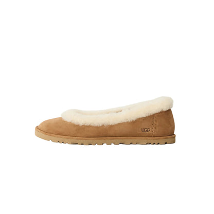 Tan UGG slipper with white fur lining on a light gray background