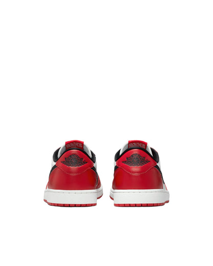 Red sneakers with black swoosh logo on a white background