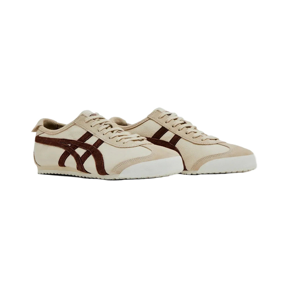 Beige and brown sneakers on a white background