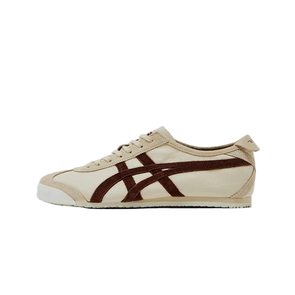 Beige sneaker with brown stripes on a white background