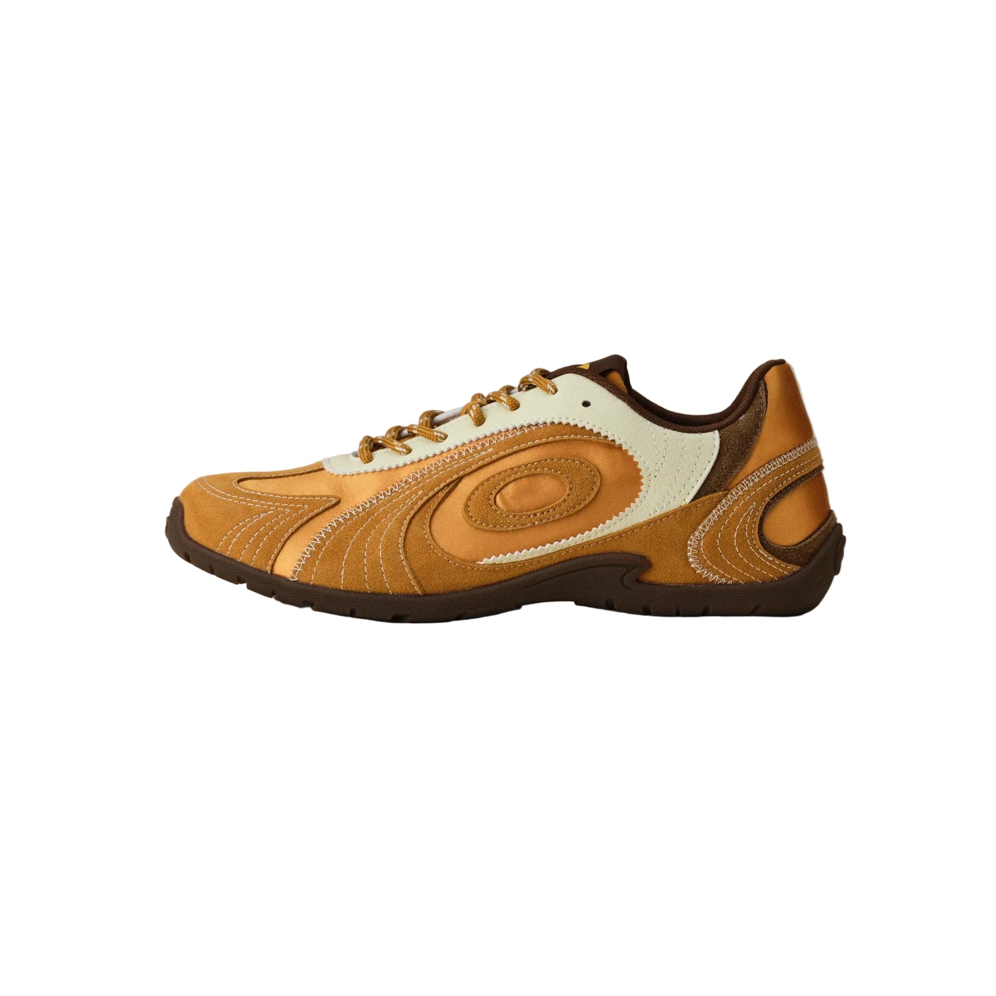 A low-top athletic sneaker in tan and brown with cream accents, shown in a side profile against a neutral gray background.