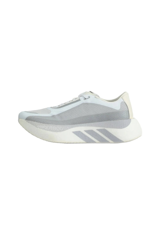 A light gray and off-white Adidas running shoe shown from the side against a plain light gray background.
