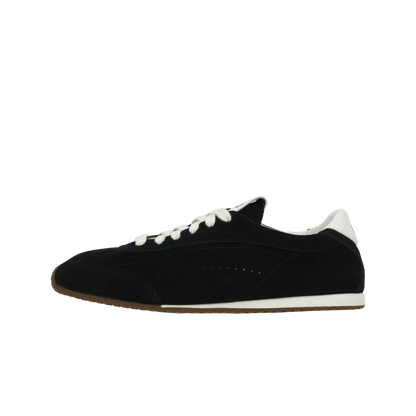 Black sneaker with white accents on a white background