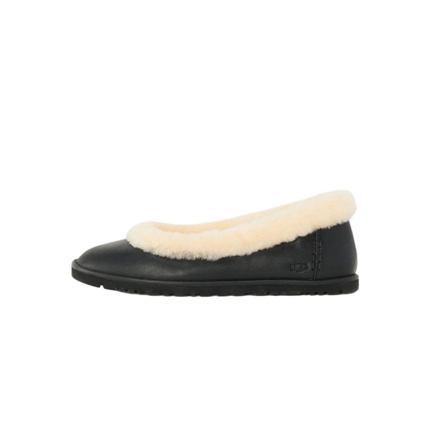 Black slip-on shoe with white fur lining on a light gray background