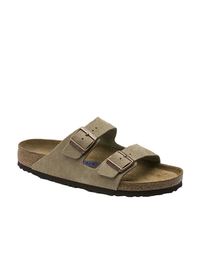 Brown sandal with double buckle on a white background