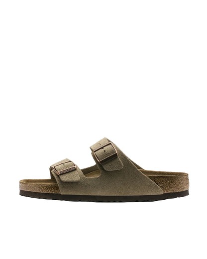 Brown sandal with a strap on a white background