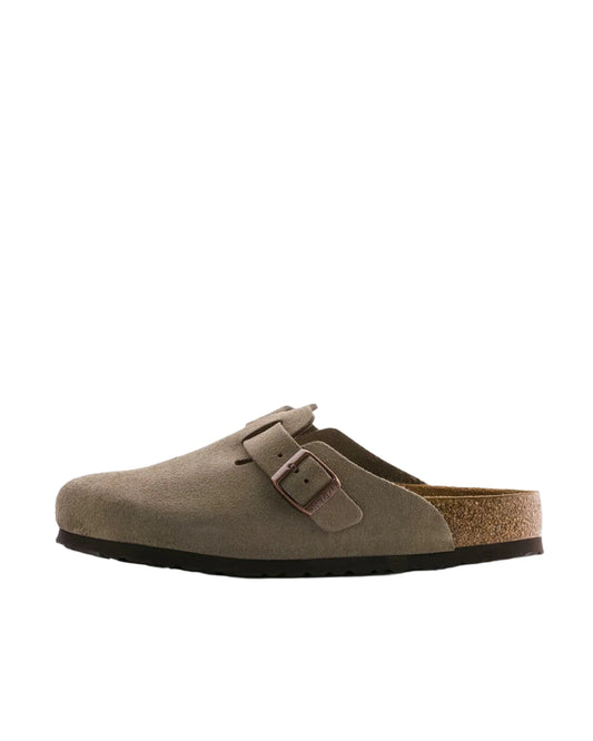 Brown suede clog shoe on a white background